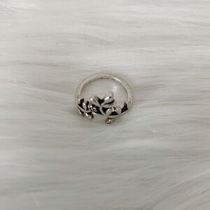 Beautiful floral design, climbing ring. Antiqued silverplate. Size 5.